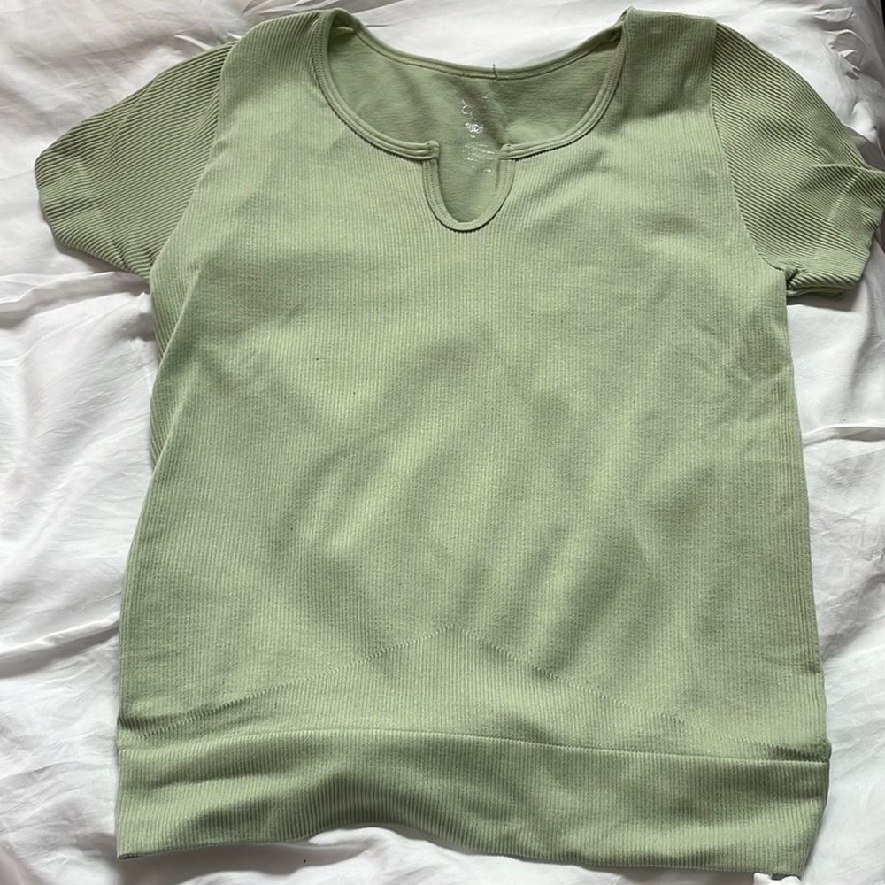 This is a Sage green top! It’s from TJmaxx. It is a tight fitting top!